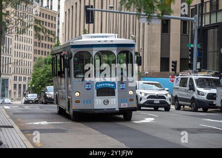 City view trolley tours and a Boston Duck Tour land and water amphibious duck vehicle tour for tourists in Boston Stock Photo