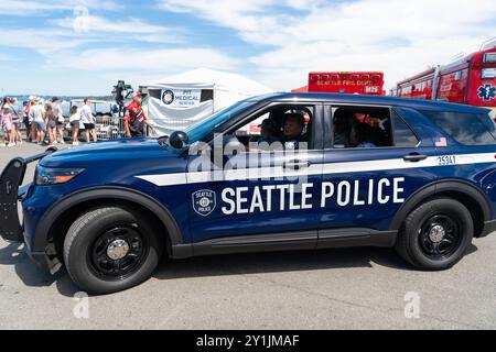 Seattle, WA, USA -July 3, 2024: Blue and white Seattle police car parked on street. Seattle state police. Stock Photo