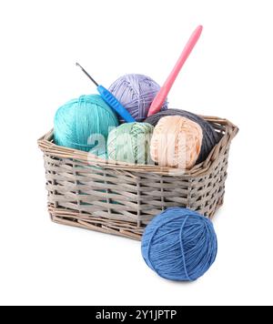Many colorful yarns and crochet hooks in wicker basket isolated on white Stock Photo