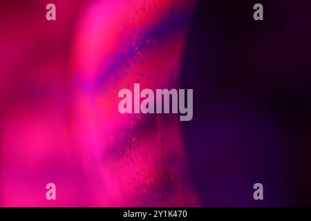 Pink fluid sphere, fluid background, plasma, fluid movement, red sphere, dark gloomy background, smooth moving, dark sci-fi art Stock Photo
