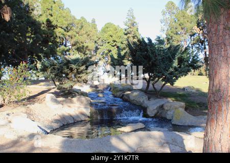 waterfall fountain with rock feature in park Stock Photo