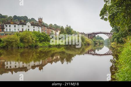 A multi image panorama of the Iron Bridge spanning the River Seven in Ironbridge, Shropshire seen along the riverside. Stock Photo