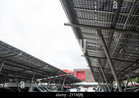 Solar panel installed in parking lot Stock Photo