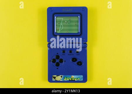 Top view of a classic pocket sized soccer video game console Mitashi game-in. Stock Photo
