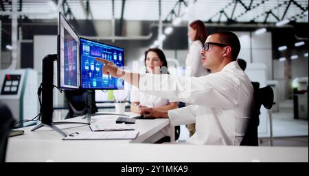 Engineer Operators Using Scada System At Industrial Plant Stock Photo