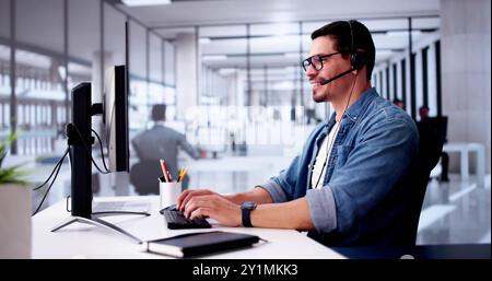 Call Center Operator Sitting Working At Office Stock Photo