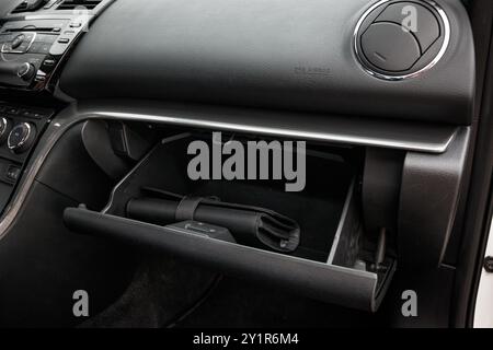 Prague, Czech republic - July 20, 2021: White Mazda 6 gh Black tool bag inside open car glove box compartment Stock Photo