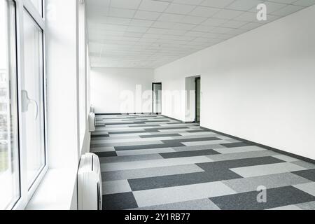 Empty office space With Checkered Floor and Windows Stock Photo