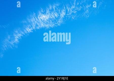 Blue sky with white delicate clouds with free space. Stock Photo