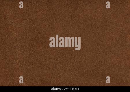 Natural brown suede texture. Genuine shammy-leather texture or background, close-up, high resolution. Stock Photo