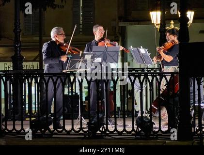 String Quartet on the Bandstand playing a Concerto in the Place National in Antibes old town, French Riviera. Stock Photo