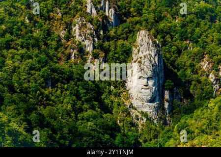 Orsova, Romania - September 2, 2021: Rock sculpture of Decebalus Rex, last king of Dacia. It is the tallest stone sculpture in Europe and the second i Stock Photo