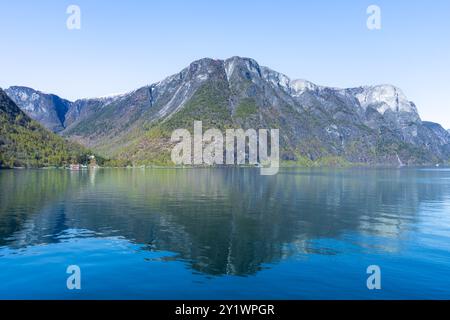 Along the way there are snow-capped mountains, waterfalls and lake reflections. Cruise the World Heritage Sognefjord and enjoy the beautiful scenery. Stock Photo