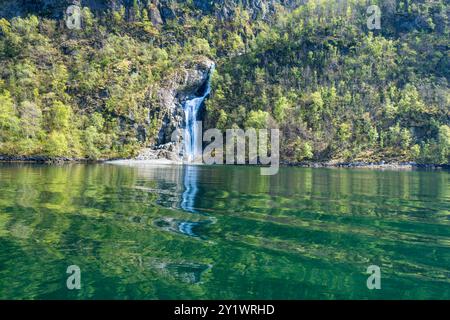 Along the way there are snow-capped mountains, waterfalls and lake reflections. Cruise the World Heritage Sognefjord and enjoy the beautiful scenery. Stock Photo