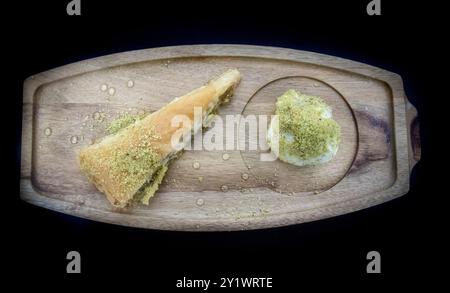 Baklava with Ice Cream on Wooden Board Stock Photo