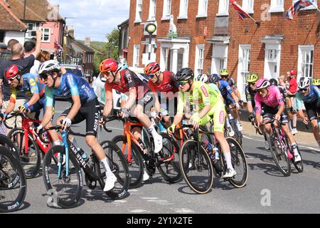 Wickham Market, UK. 8th Sep 2024. The men's cycling event, the Tour of Britain, finishes today with stage 6 in East Suffolk, starting in Lowestoft and finishing in Felixstowe. The riders are passing through Wickham Market. Tom Donnenwirth of team Decathlon AG2R La Mon. Dev. and Connor Swift of team Ineos Grenadiers in the pelaton. Credit: Eastern Views/Alamy Live News Stock Photo