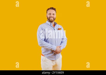 Smiling Bearded Man In Shirt On Orange Background Stock Photo