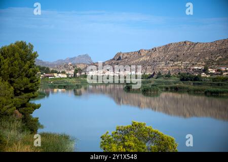 Ojos Reservoir, in the Ricote Valley, Region of Murcia, Spain, with the calm waters reflecting the mountains Stock Photo