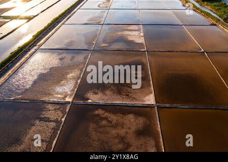 Basins with seawater to evaporate under sun and wind on Pag Island. Traditional methods of production high-quality sea salt in Croatia Stock Photo