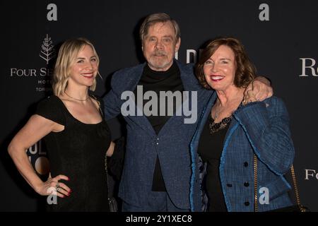 Chelsea Hamill (L), Mark Hamill (C) and Marilou York (R) attend the 'Road to the Golden Globes' Party during the 2024 Toronto International Film Festival at the Four Seasons Hotel. Stock Photo