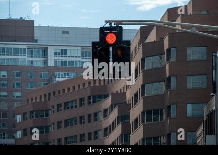 Signs and traffic lights help control traffic flow on intersections in Boston. Stock Photo