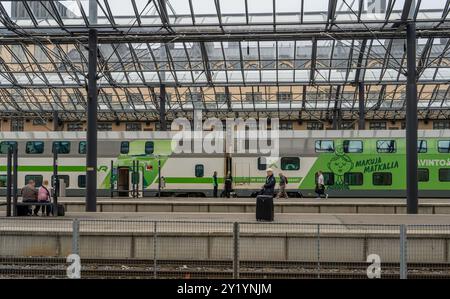 Passengers at conmuting and long distance train platforms at Helsinki main Train station,Finland,Europe Stock Photo