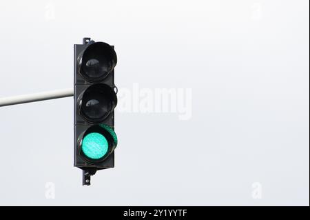 Green light on traffic lights. Isolated on white background. Negative copy space for placement of text. Stock Photo