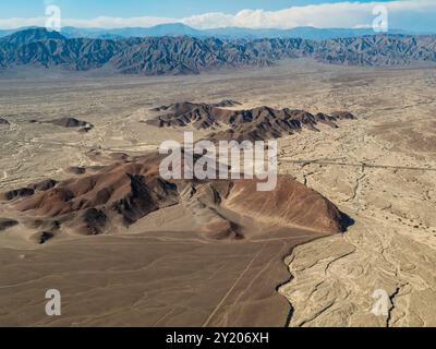 Impressive aerial view of Nazca desert, with mountains and valleys marked by geoglyphs and lines, Peru Stock Photo