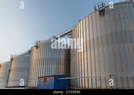 Panoramic view of industrial silos and grain storage facilities at sunset. elevator, grain storage facility Stock Photo