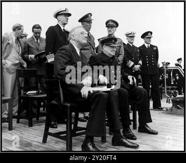 The Atlantic Charter was a pivotal policy statement issued during World War II, following a meeting between U.S. President Franklin D. Roosevelt and British Prime Minister Winston Churchill in August 1941. The conference, often referred to as the Atlantic Charter Conference, took place aboard a warship off the coast of Newfoundland. Stock Photo