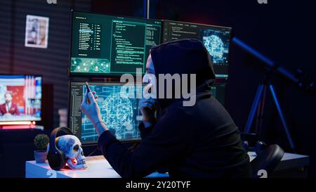 Hacker inserting USB in computer after managing to steal sensitive data, close up. Scammer uploading storage drive into PC after obtaining sensitive information from users using malware, camera B Stock Photo
