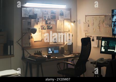 Modern detective office with workplace and board Stock Photo - Alamy