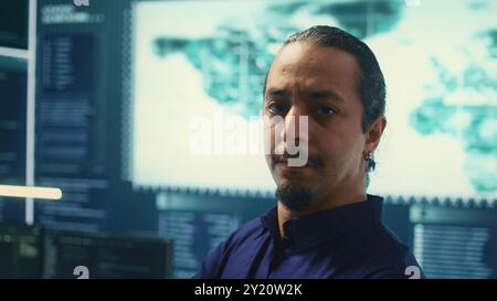 Cybersecurity team investigating cybercrime and malware attacks. IT security experts analyzing threats and protecting national security, working on data protection and privacy. Cyberwarfare. Camera B. Stock Photo
