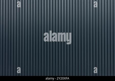 simple and clean image of a black fence, serving as a backdrop. The texture and color of the fence create a minimalist and neutral background, perfect Stock Photo