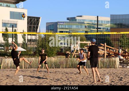 A beach volley ball game on sand in the middle of Töölönlahti park in central Helsinki, Finland, August 2024 Stock Photo