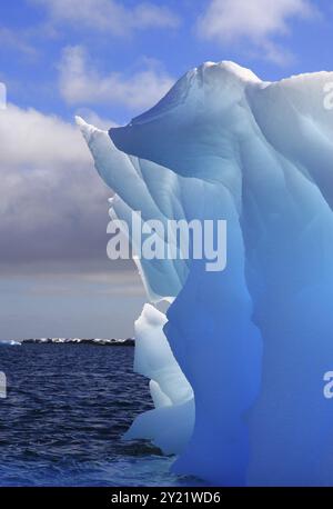 Blue shimmering beautiful iceberg in Antarctica Stock Photo