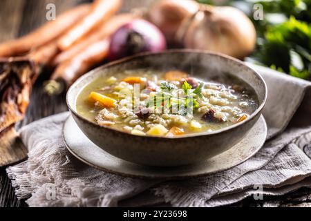 Soup made from barley groats, smoked pork neck, potatoes and root vegetables. Stock Photo