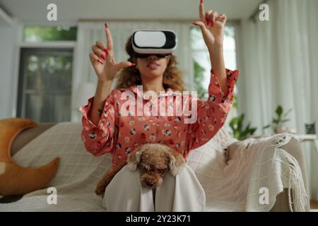 Woman Using Virtual Simulation At Home Stock Photo