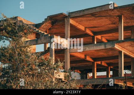 Old abandoned unfinished concrete structure in Vrasna, Greece. Selective focus. Stock Photo