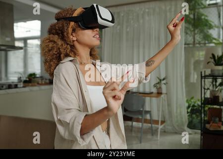 Woman Using Virtual Reality Simulation Stock Photo