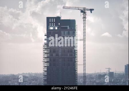 Modern skyscraper is being built in an urban city center of Limassol, Cyprus Stock Photo