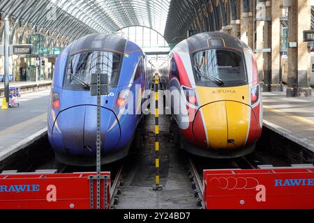 Train driver cabs at Kings Cross buffers Blue Lumo open-access operator a new competitor to LNER Azuma East coast passenger services Camden England UK Stock Photo