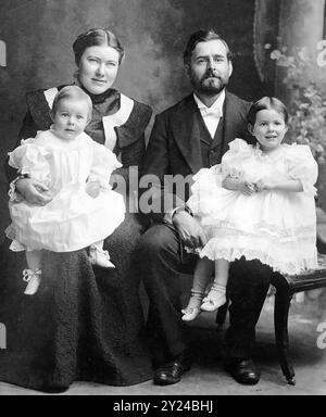 Hemingway family studio portrait, taken May 21, 1900. Grace with 10 month old Ernest on her lap. Clarence, with 2 year old Marcelline on his lap Stock Photo