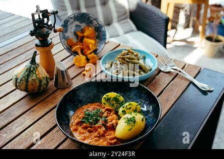 A vibrant spread of seasonal dishes featuring stewed vegetables, Stock Photo