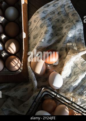 Eggs in a carton and basket with soft shadows Stock Photo