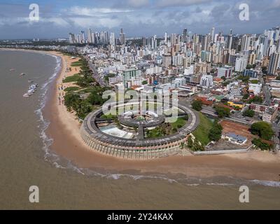 Beautiful aerial view to abandoned round hotel building by the ocean Stock Photo