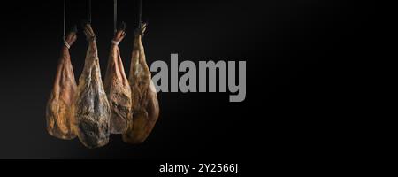 Slicing Spanish íberic ham. Spanish jamon and traditional food.Dry Spanish ham, Jamon Serrano, Bellota, Italian Prosciutto Crudo or Parma ham. Stock Photo