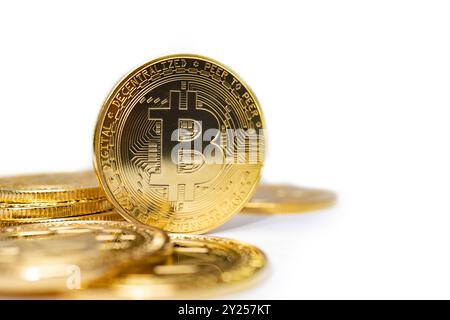 Bitcoin gold coins on white background. Finance and investment concept. Stock Photo