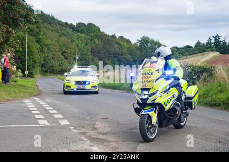 Police monitoring progress at road junction before arrival of riders in Stage 1 of Men's Tour of Britain Cycle Race, Kelso to Kelso, Scottish Borders. Stock Photo