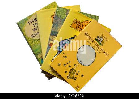 Selection of childrens books with Winnie-the-Pooh book  by A A Milne on top isolated on white background Stock Photo